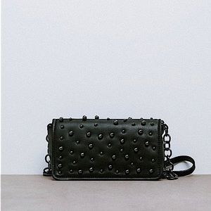 Crossbody bag with beads on exterior. never used without tag